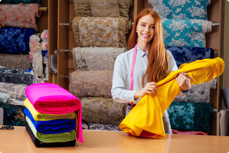 redhaired-ginger-business-woman-working-at-textile-2022-05-16-00-15-10-utc 1